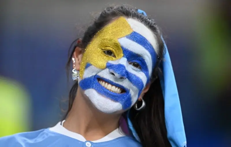 Friendly Uruguayan people sharing mate in a social gathering
